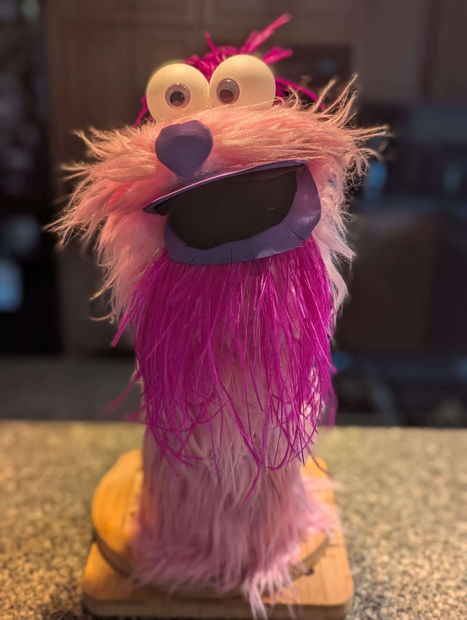 A scary pink puppet made mostly out of hot glue and mistakes.